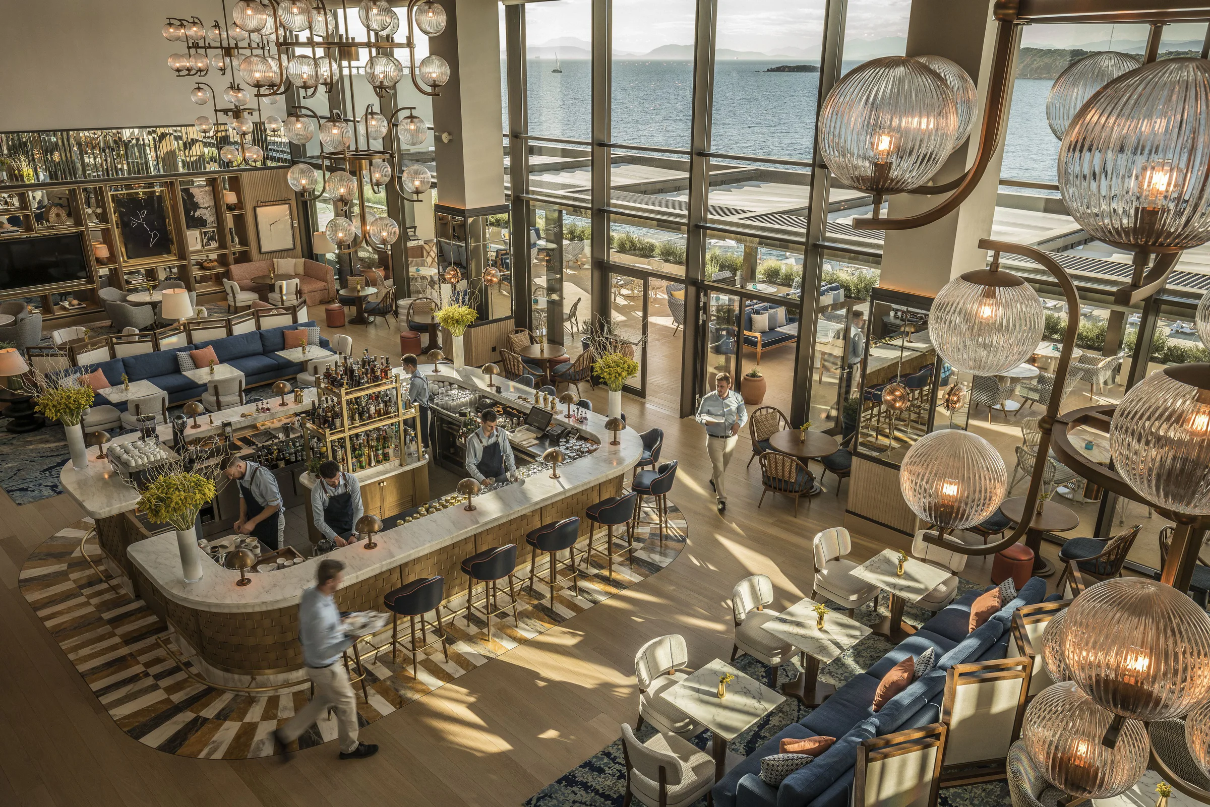 Double-height Four Seasons lounge and bar overlooking the Saronic Gulf